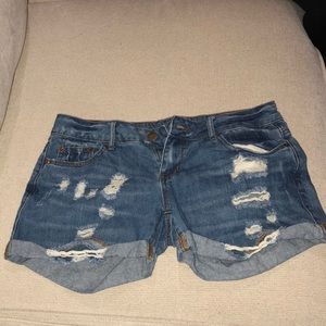 Mid rise destroyed jean shorts